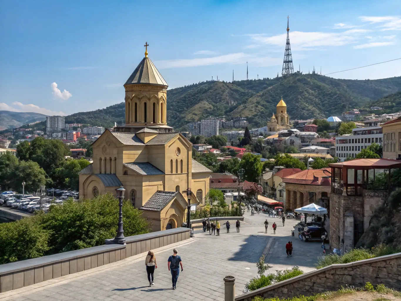 A landscape image of Tbilisi, Georgia, showcasing the city's architecture and natural beauty.