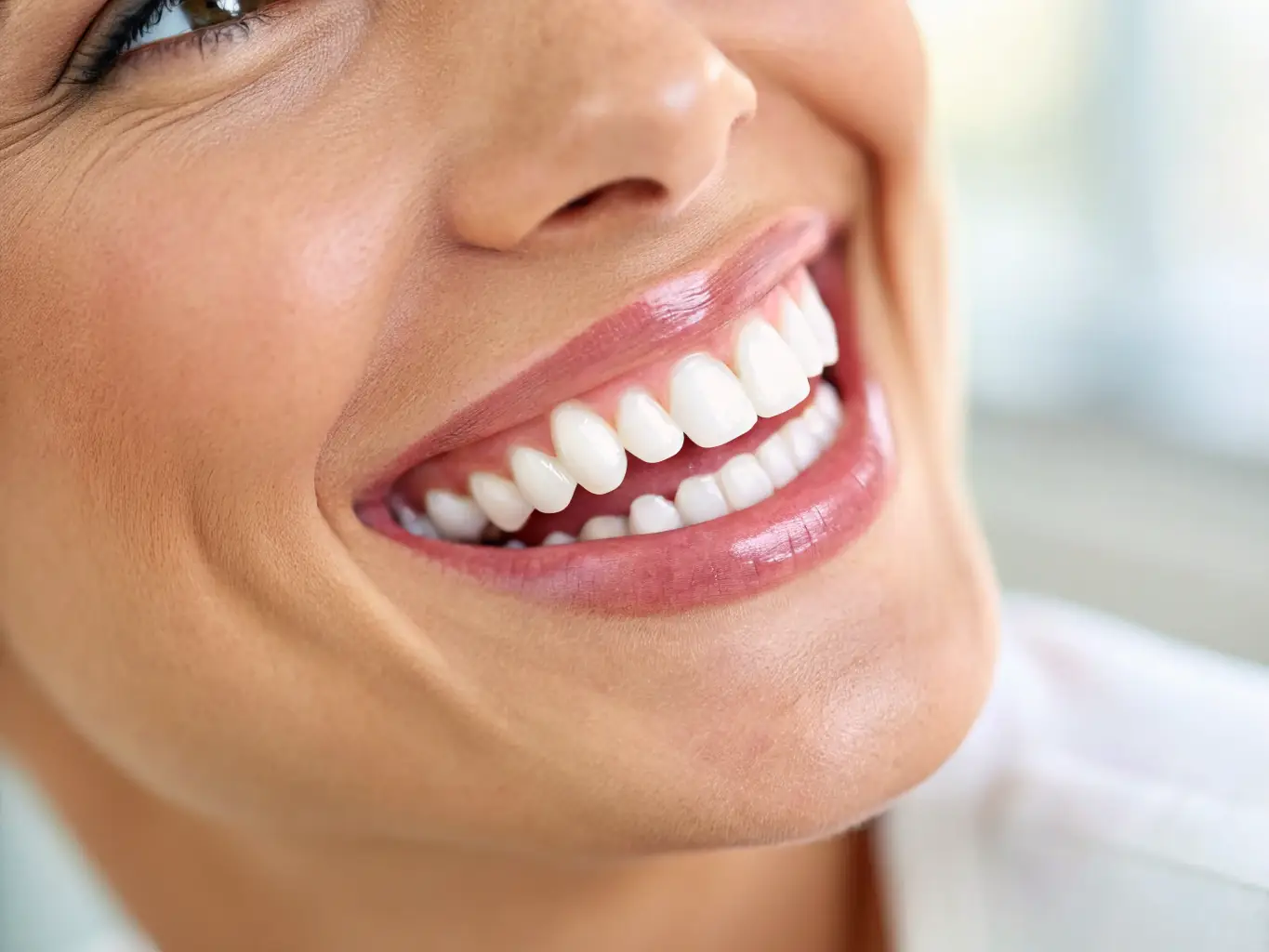 A close-up of a perfect set of teeth with dental implants, showcasing a natural and confident smile.