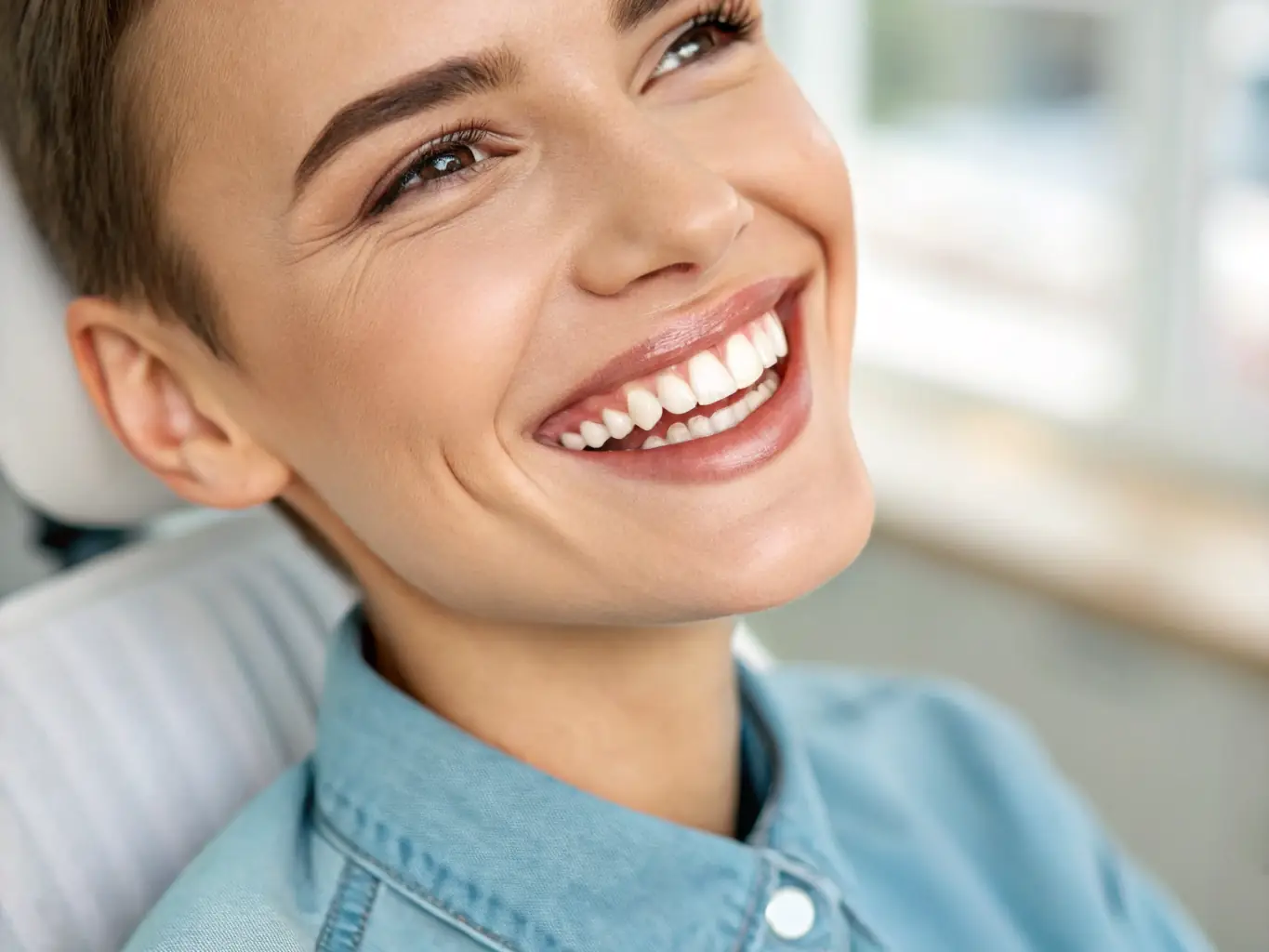 A person with a perfect smile after dental veneers treatment.