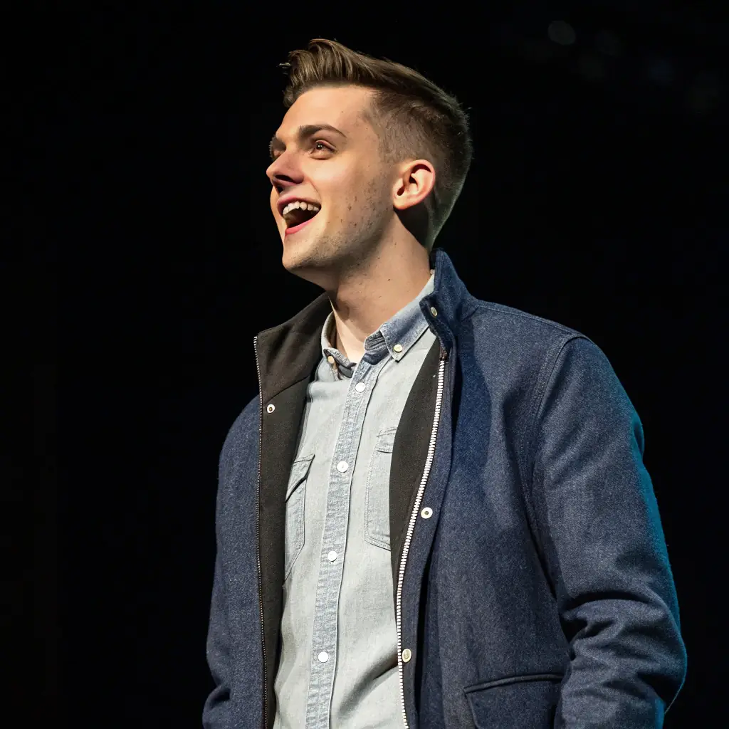 Charlie is a young man with stylish hair and a friendly, energetic expression.