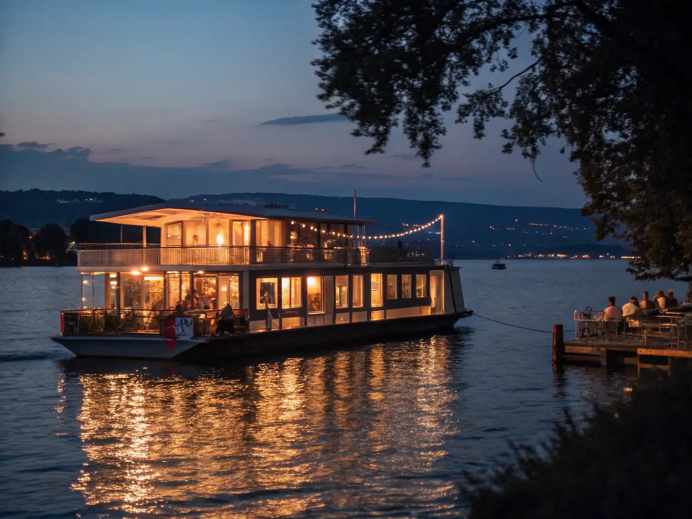 A houseboat gently anchored in a calm bay at night, with soft lights illuminating the deck. The scene is serene and peaceful, highlighting the tranquility of anchoring at night.